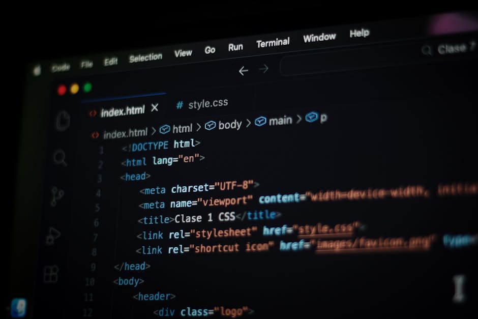 A close-up view of a computer screen displaying a web development code editor with HTML and CSS code. The code includes elements such as DOCTYPE declaration, html, head, meta tags, and a link to a sty